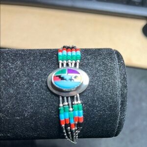 Red and Blue Bracelet with Silver Strands and Iridescent Stone